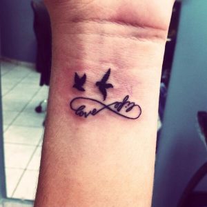 tatuaje signo infinito frase love life aves