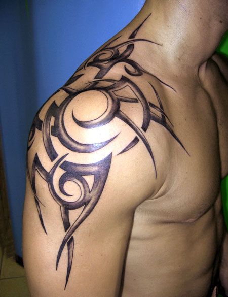 gorgeous owals black mens shoulder tattoo