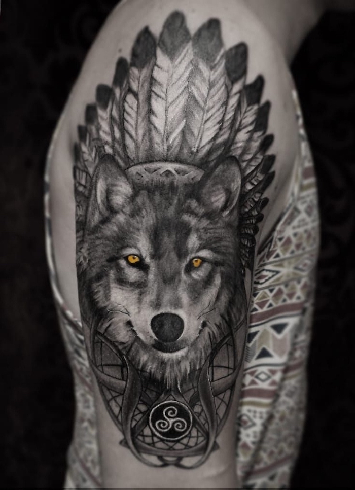 large wolf head feathers shoulder tattoo small tattoos for men yellow eyes man wearing printed top